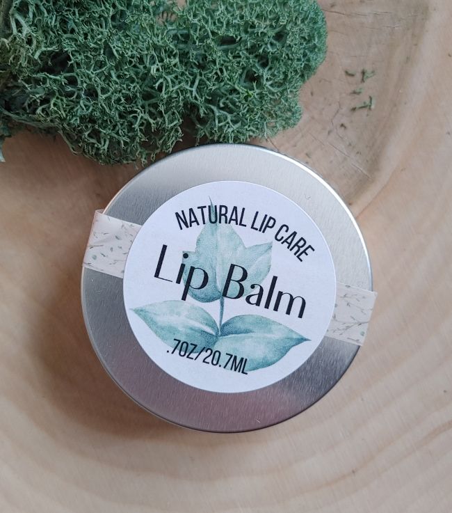 all natural lip balm hydrating lip care tin on wooden surface