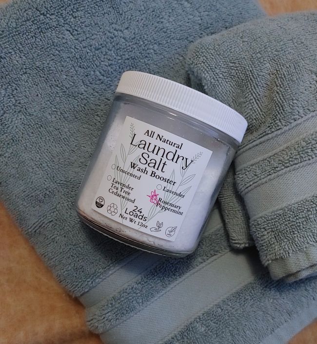 Jar of all natural laundry salt on a towel