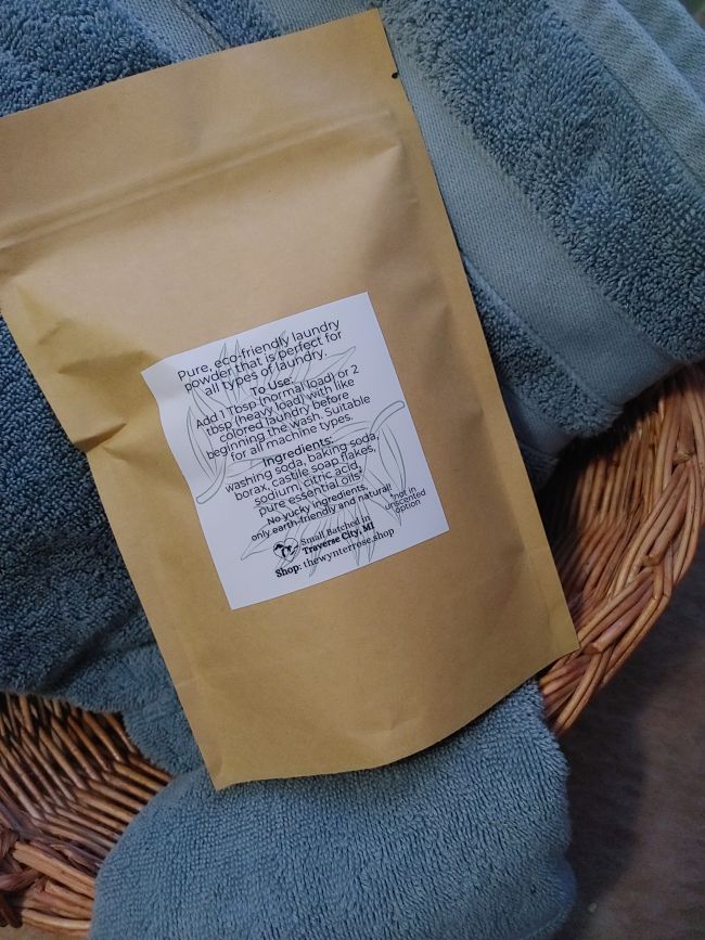 Brown paper bag with a label on a textured surface laundry wash powder