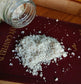body soak poured out onto red book cover magnesium body salt bath soak